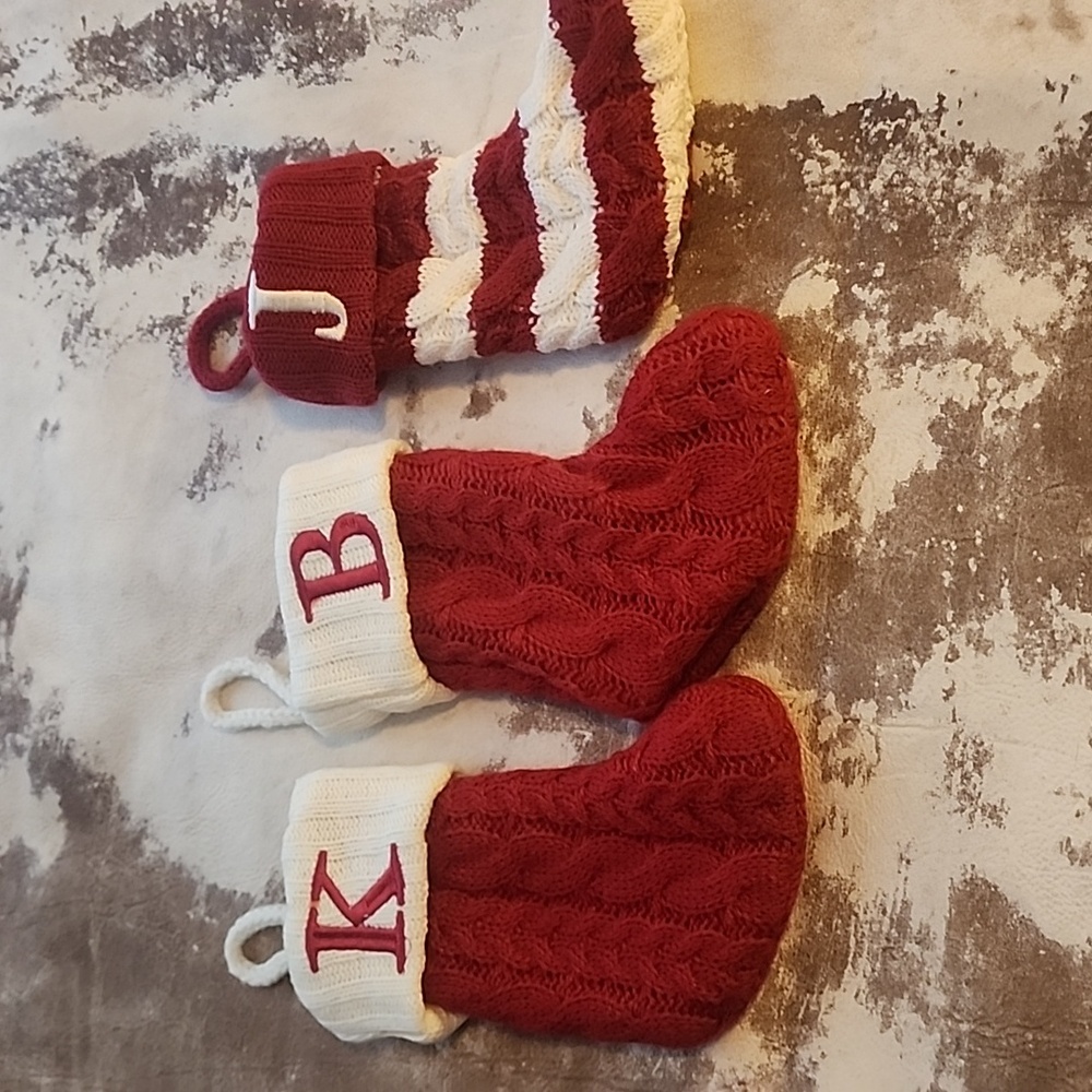 Three small holiday stockings. Size: OS